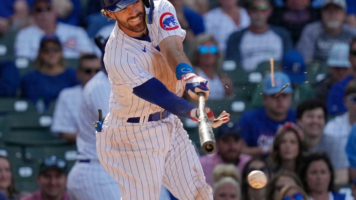 Dansby Swanson swings during a home game for the Chicago Cubs.