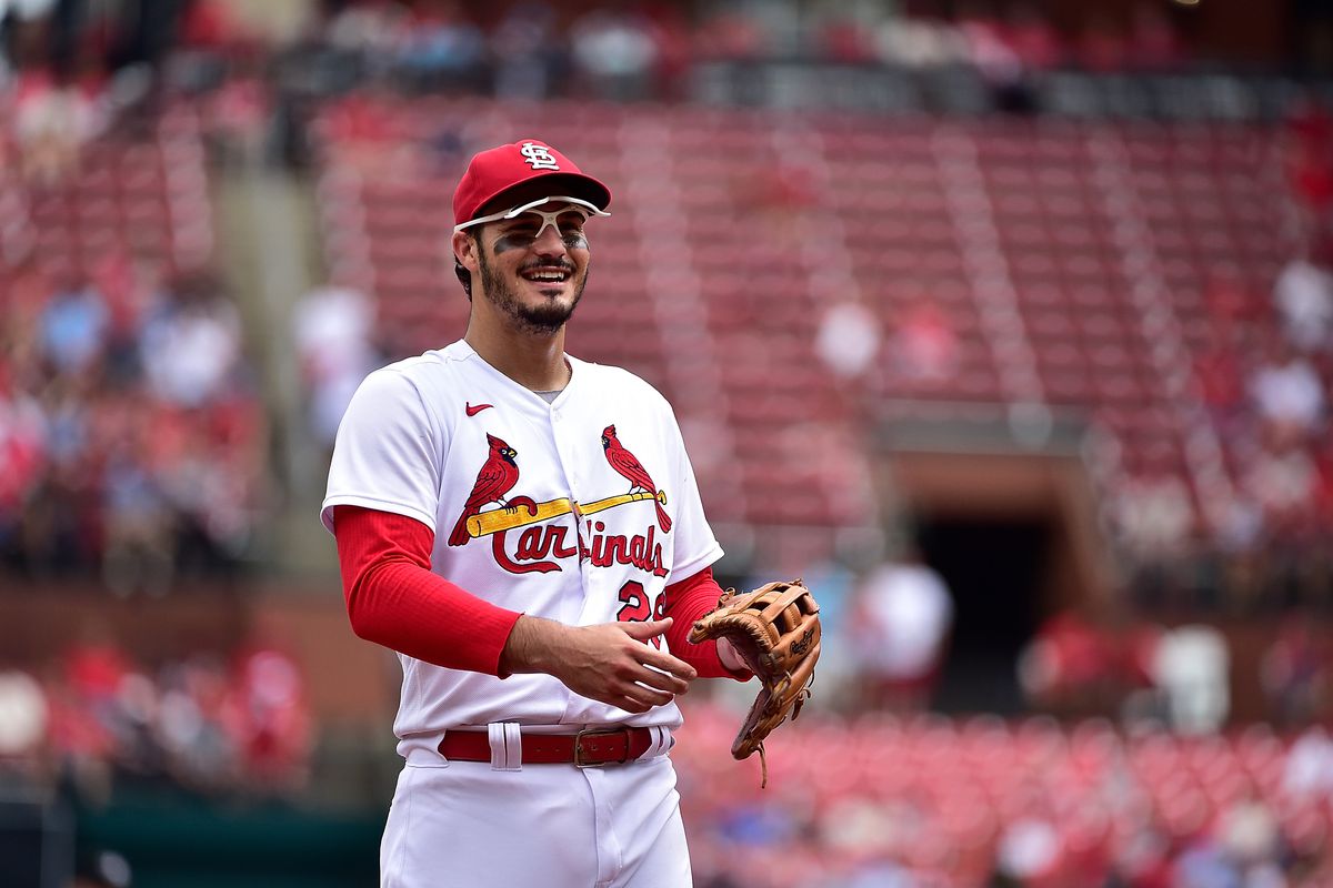 Nolan Arenado smiles toward the dugout while playing defense for the St. Louis Cardinals.