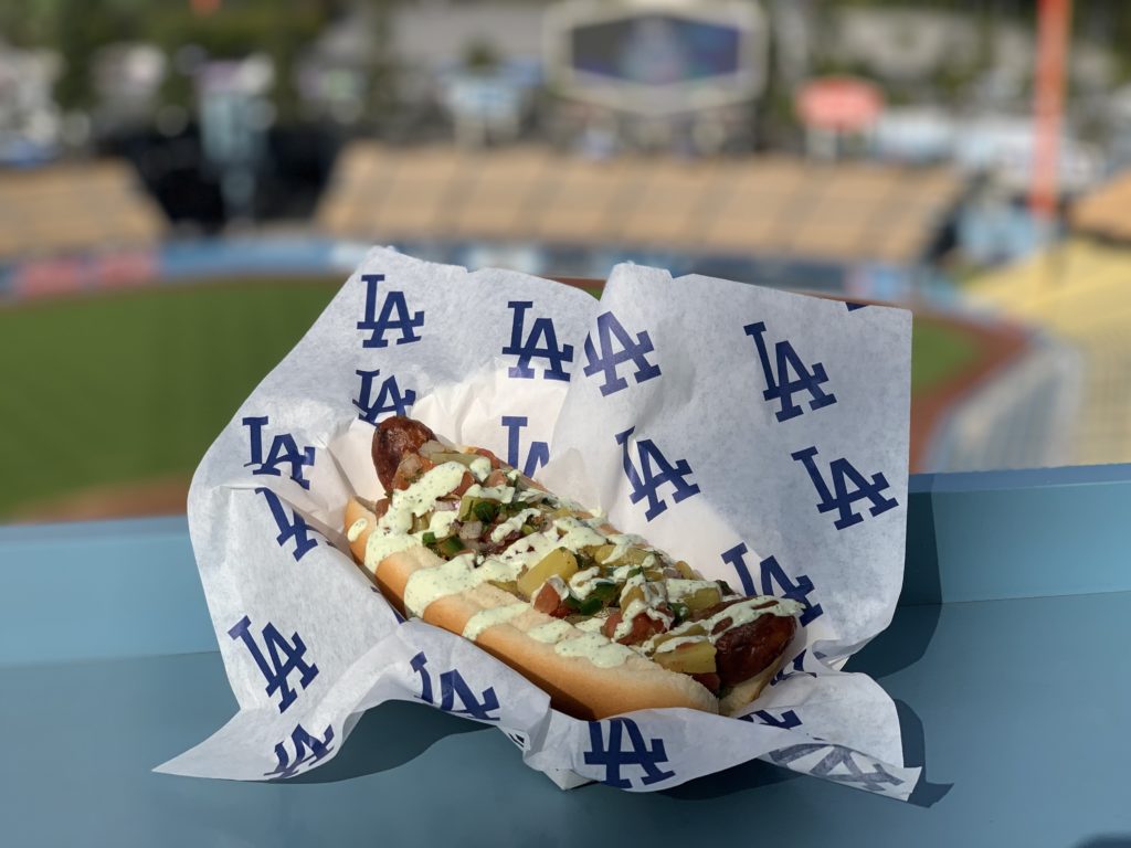 A hotdog sold at Dodger Stadium lies on a section ledge.