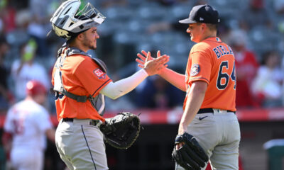 Yainer Diaz and Brandon Bielak high five after a Houston Astros win.